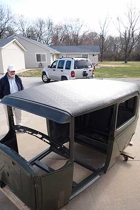 Larry Kehler checks out Terry Oberer's 1930 Model A Tudor